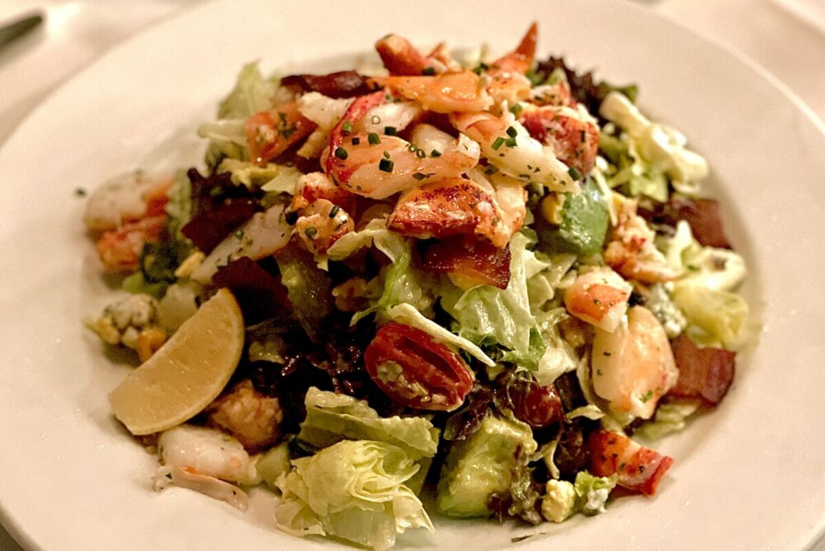 The Seafood Cobb Salad with lobster and shrimp on top from Ocean Prime Beverly Hills restaurant.