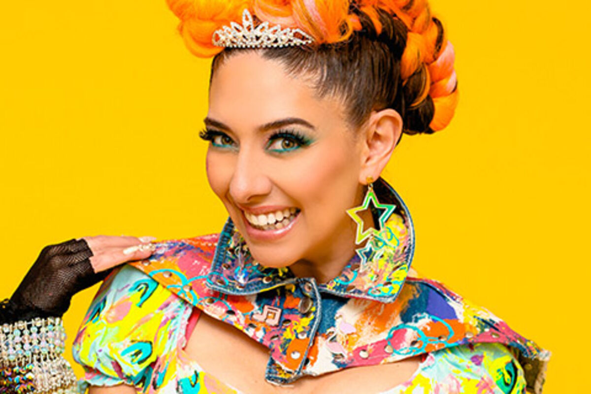 Woman with colorful dress on smiling.